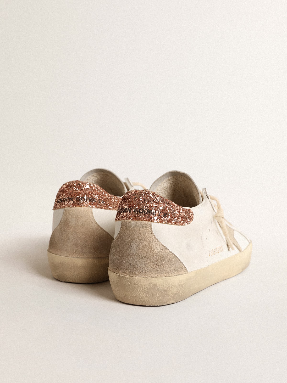 Women's Super-Star with a suede star and peach-pink glitter heel tab - Golden Goose Women