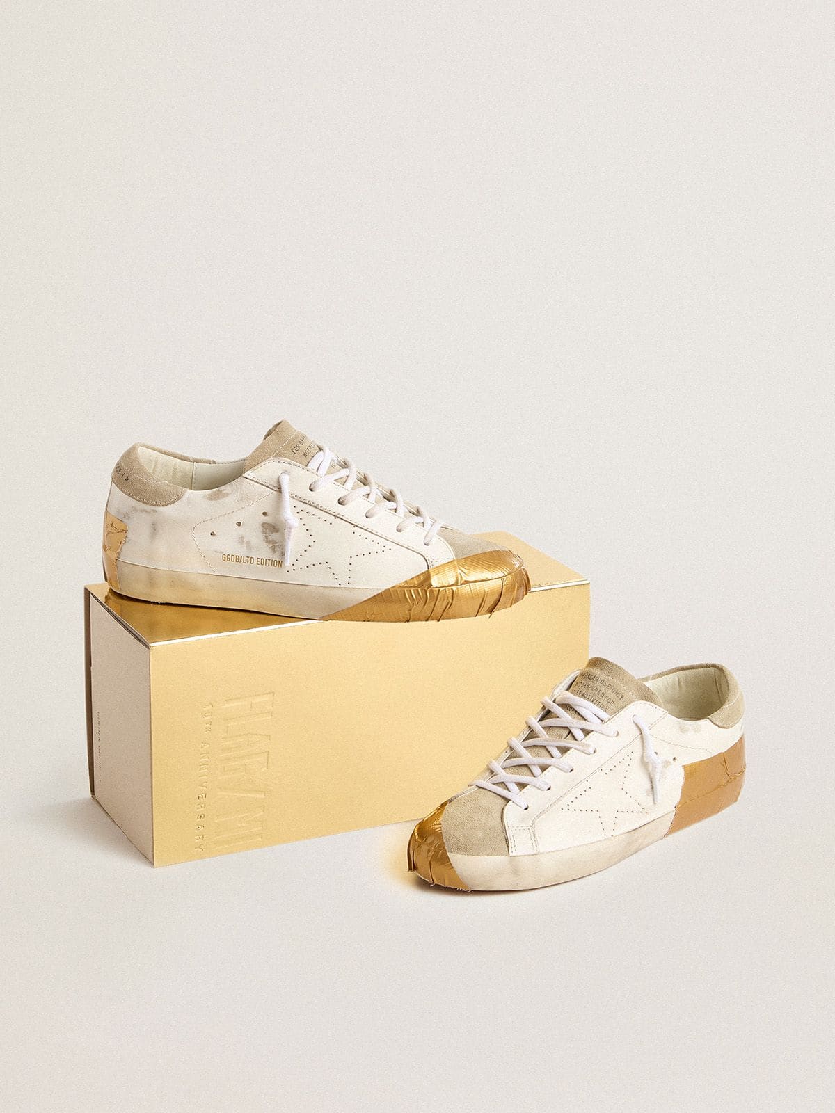 Women's Super-Star LTD in white leather with ice-gray suede inserts and gold-colored tape - Golden Goose Women