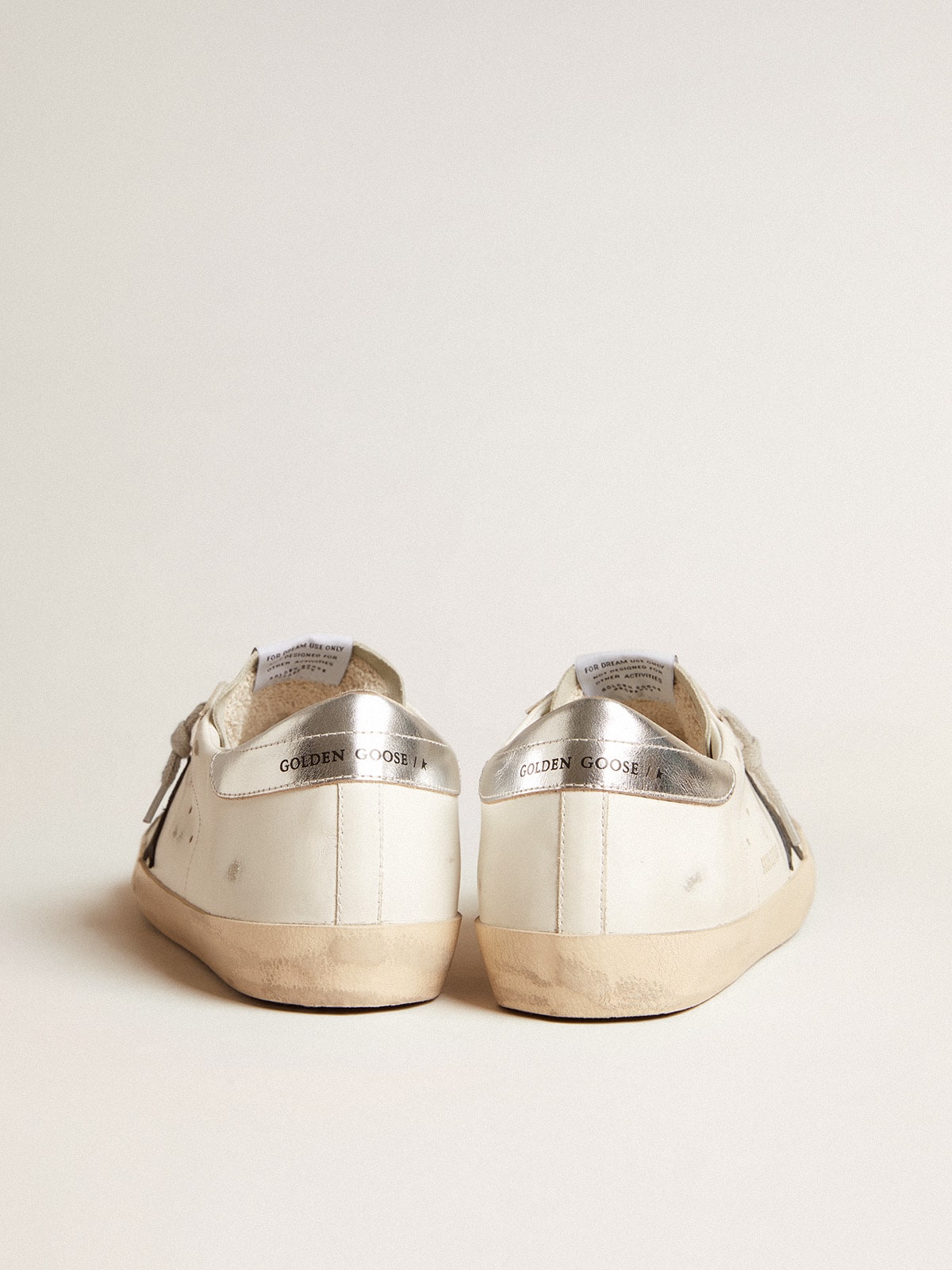 Men's Super-Star in white leather with black nubuck star and silver metallic leather heel tab - Golden Goose Men