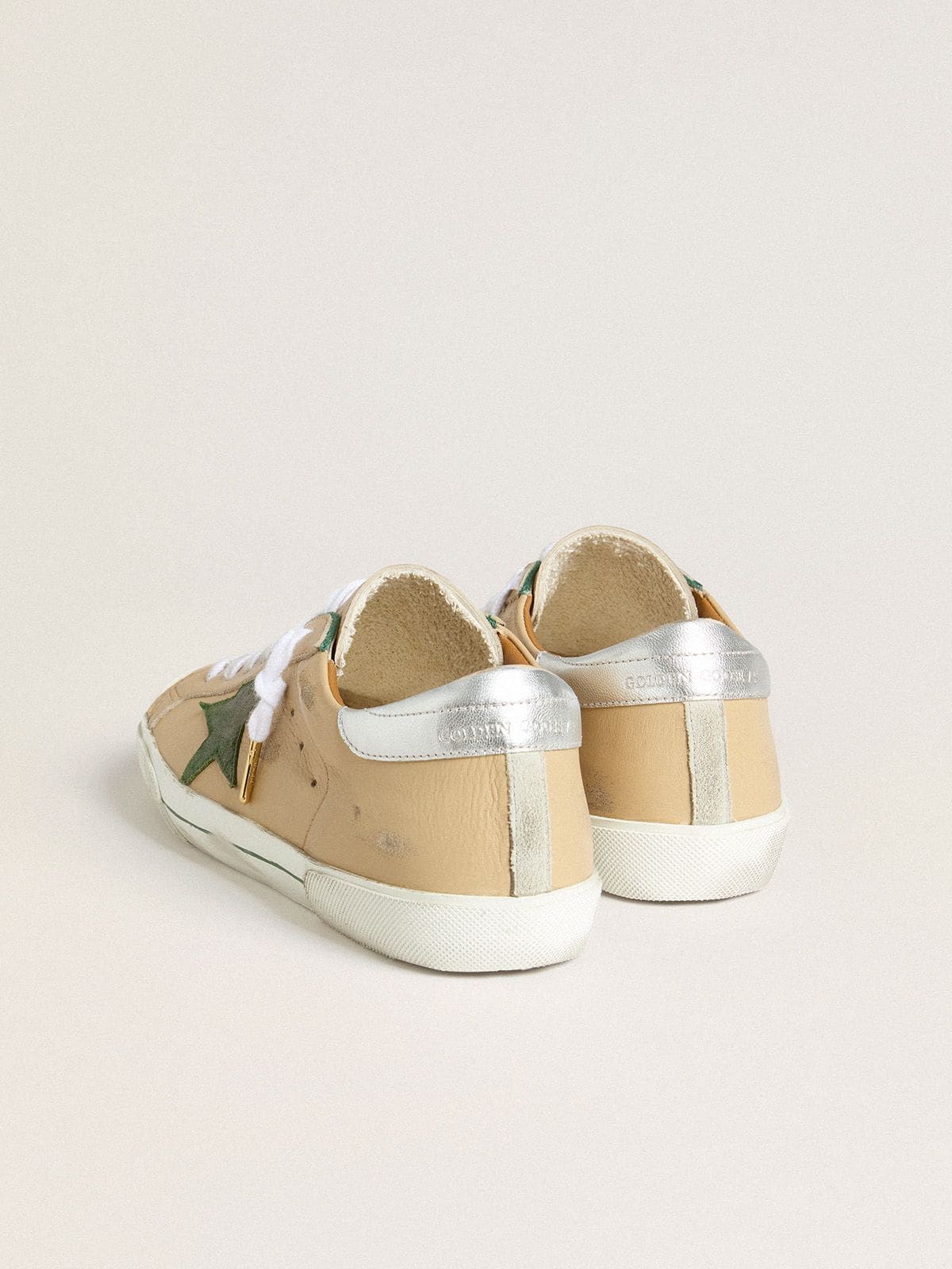 Super-Star LTD in beige leather with green suede star and silver foiled leather heel tab - Golden Goose Men