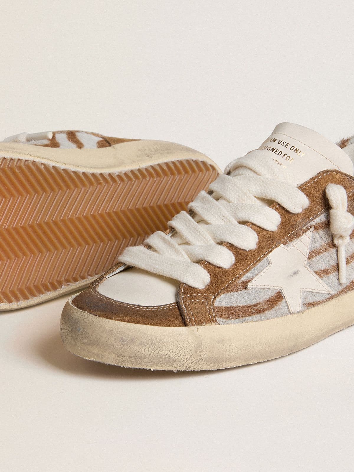 Women's Super-Star in zebra-print pony skin with leather star and brown suede inserts - Golden Goose Women