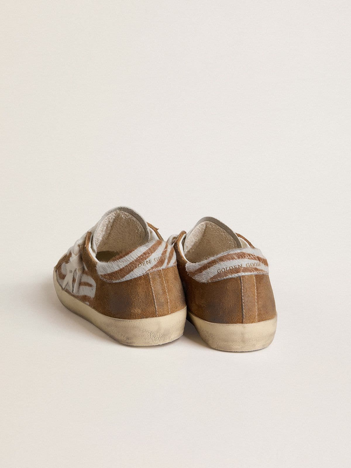 Women's Super-Star in zebra-print pony skin with leather star and brown suede inserts - Golden Goose Women