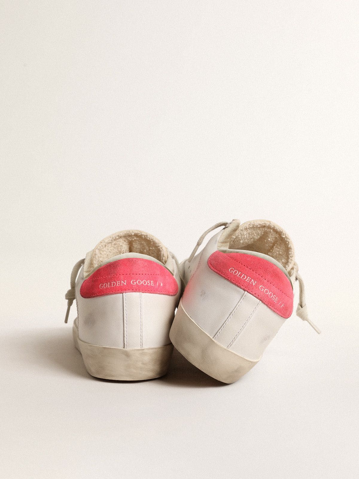 Women's white leather Super-Star with perforated star and fuchsia nylon heel tab - Golden Goose Women