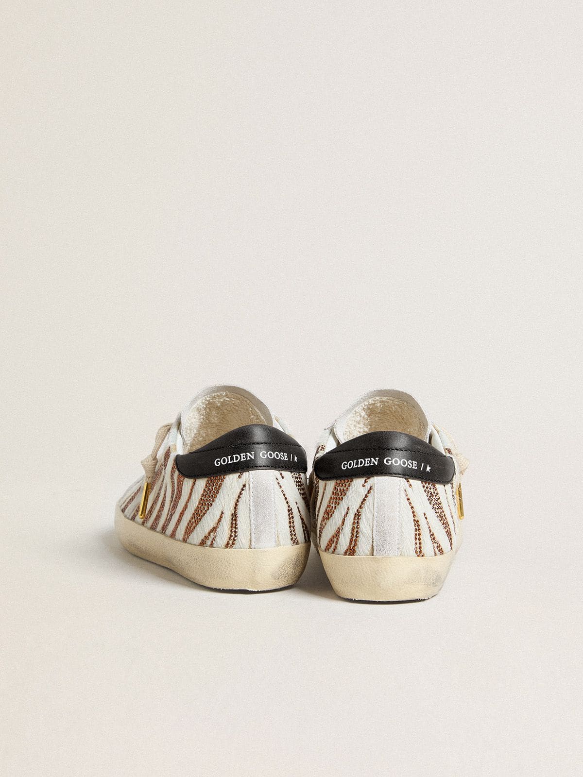 Women’s Super-Star LTD in white pony skin with brown glitter and white suede star - Golden Goose Women
