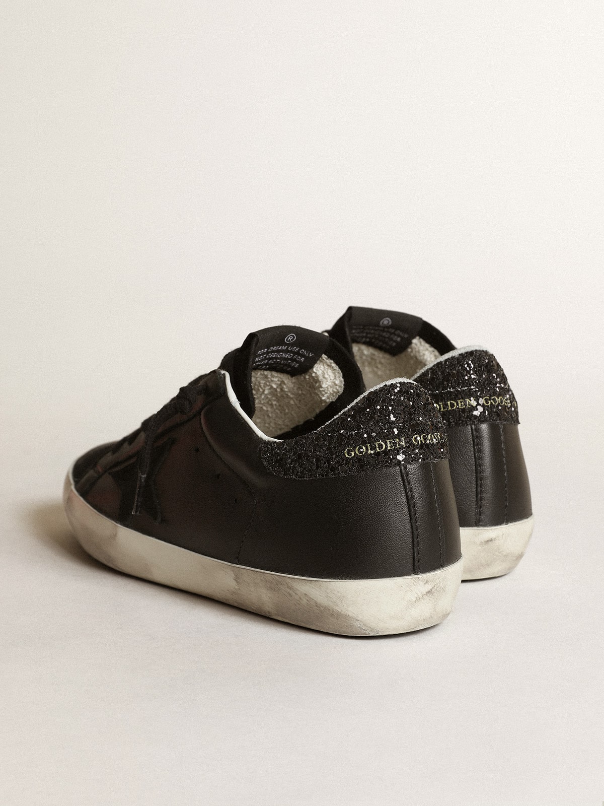 Women's Super-Star in black nappa with black star and glitter heel tab - Golden Goose Women