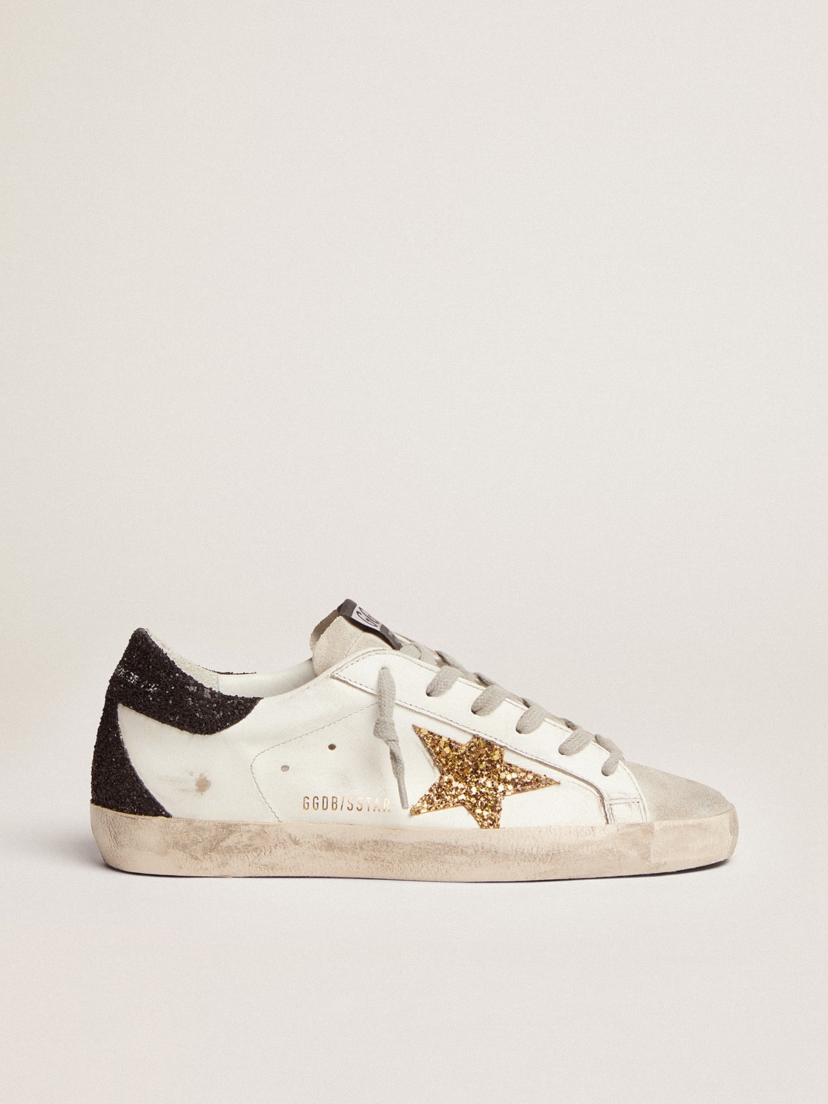 Women’s Super-Star in nappa leather with gold glitter star and black glitter heel tab - Golden Goose Women