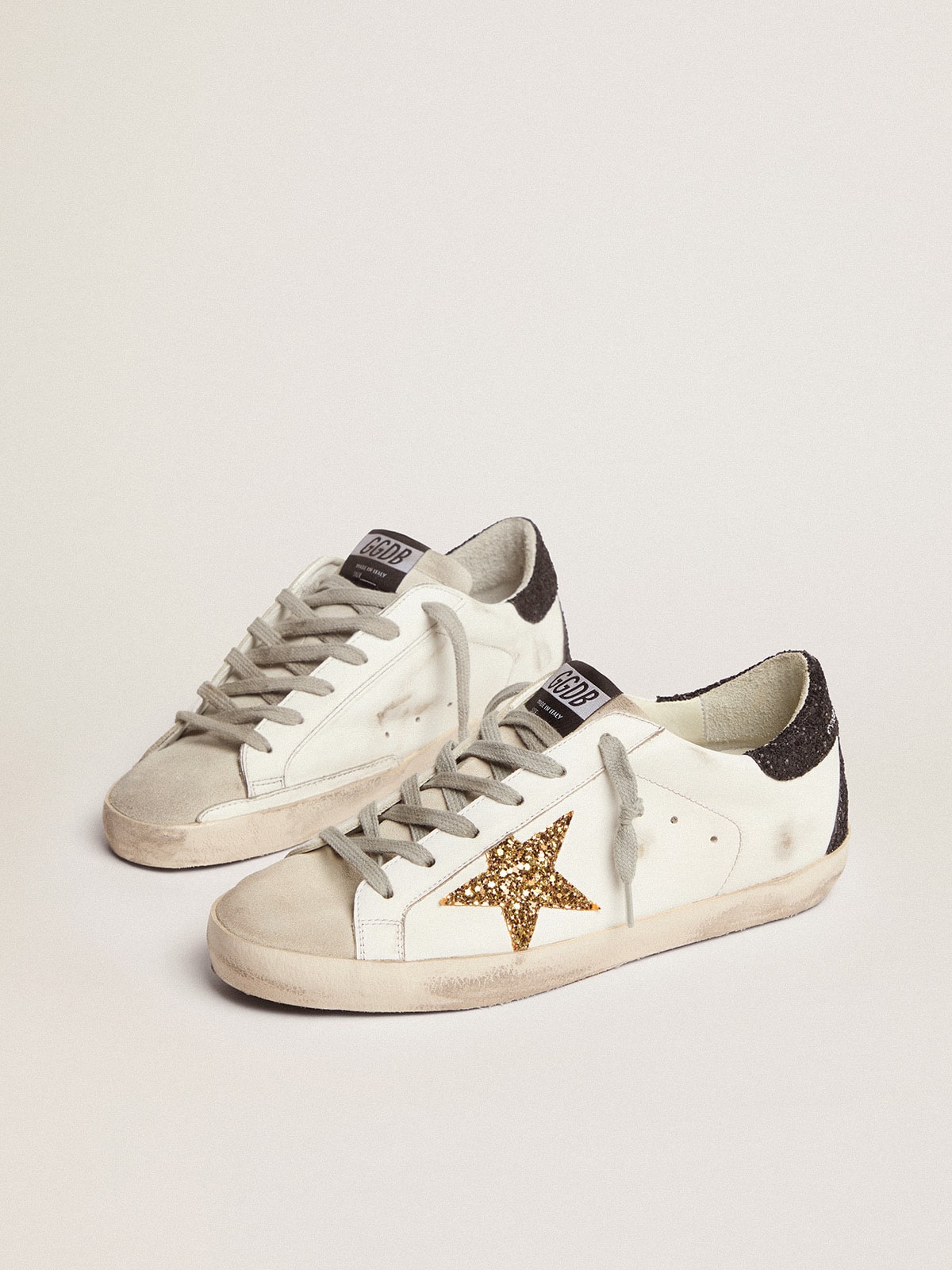 Women’s Super-Star in nappa leather with gold glitter star and black glitter heel tab - Golden Goose Women
