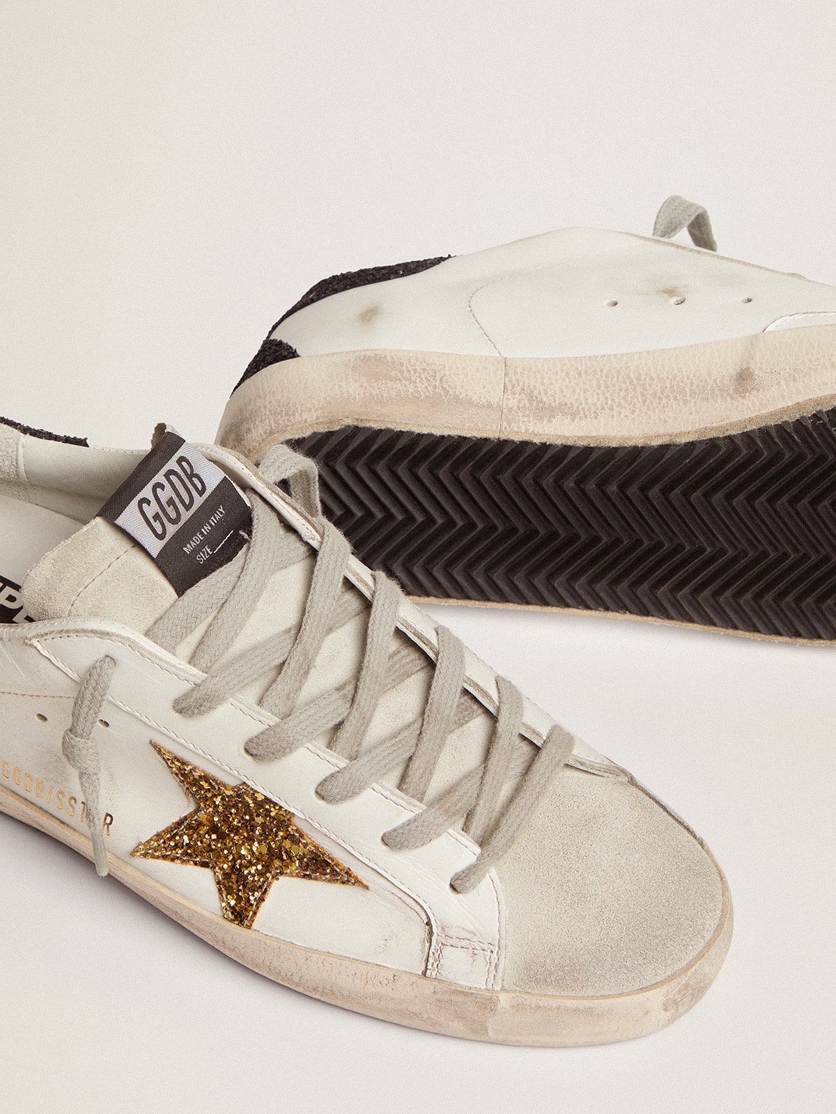 Women’s Super-Star in nappa leather with gold glitter star and black glitter heel tab - Golden Goose Women
