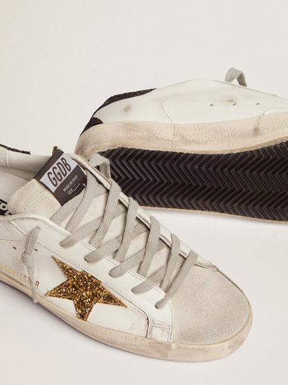 Women’s Super-Star in nappa leather with gold glitter star and black glitter heel tab - Golden Goose Women