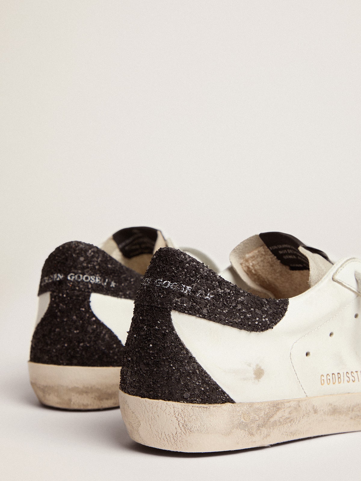 Women’s Super-Star in nappa leather with gold glitter star and black glitter heel tab - Golden Goose Women