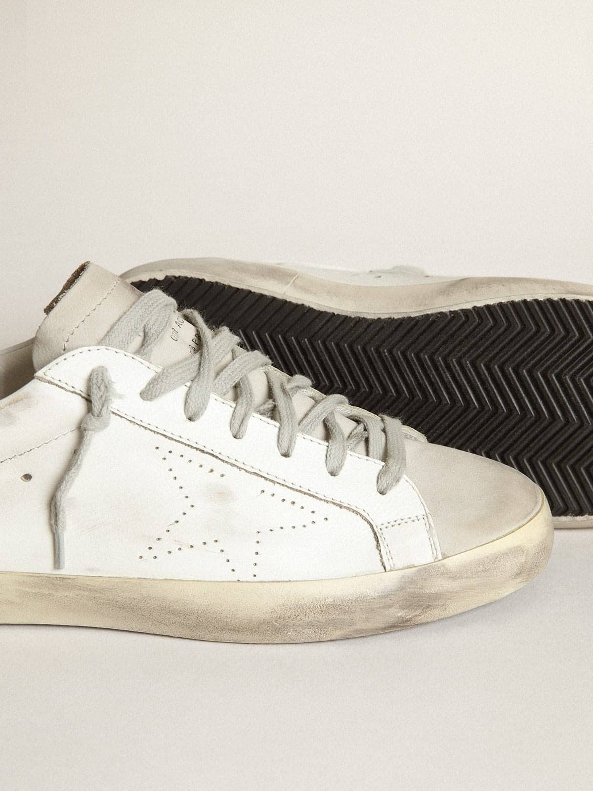 Women's Super-Star in white leather with perforated star and beige nubuck heel tab - Golden Goose Women