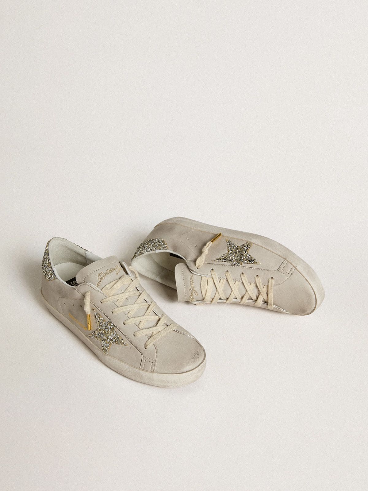 Women's Super-Star  in ivory nappa leather with platinum glitter star and heel tab - Golden Goose Women