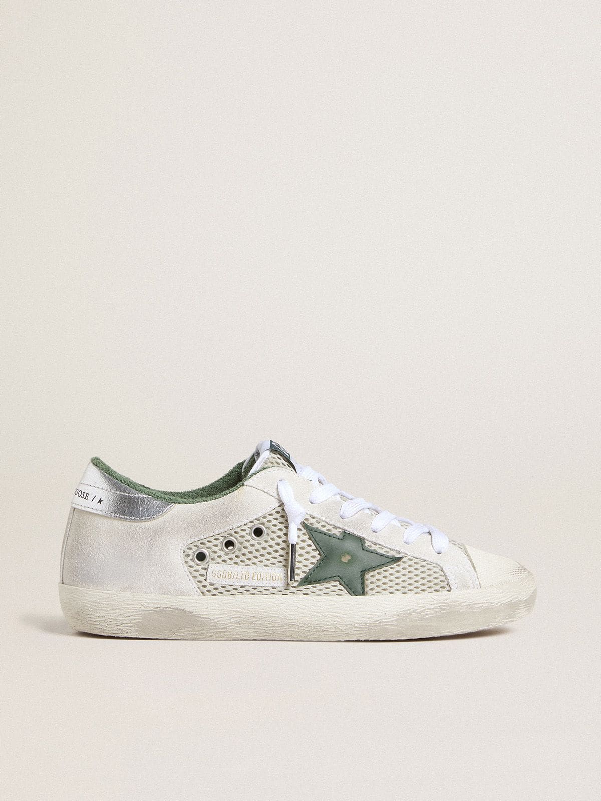 Women’s Super-Star LTD in white suede and mesh with green leather star and silver foiled leather heel tab - Golden Goose Women