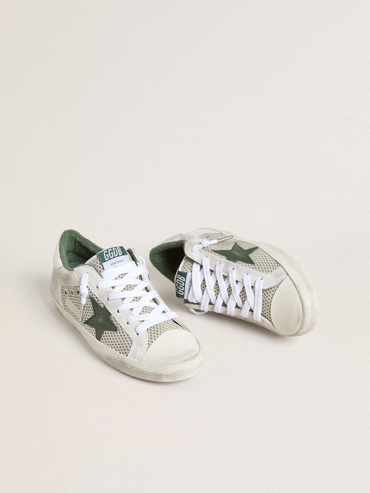 Women’s Super-Star LTD in white suede and mesh with green leather star and silver foiled leather heel tab - Golden Goose Women