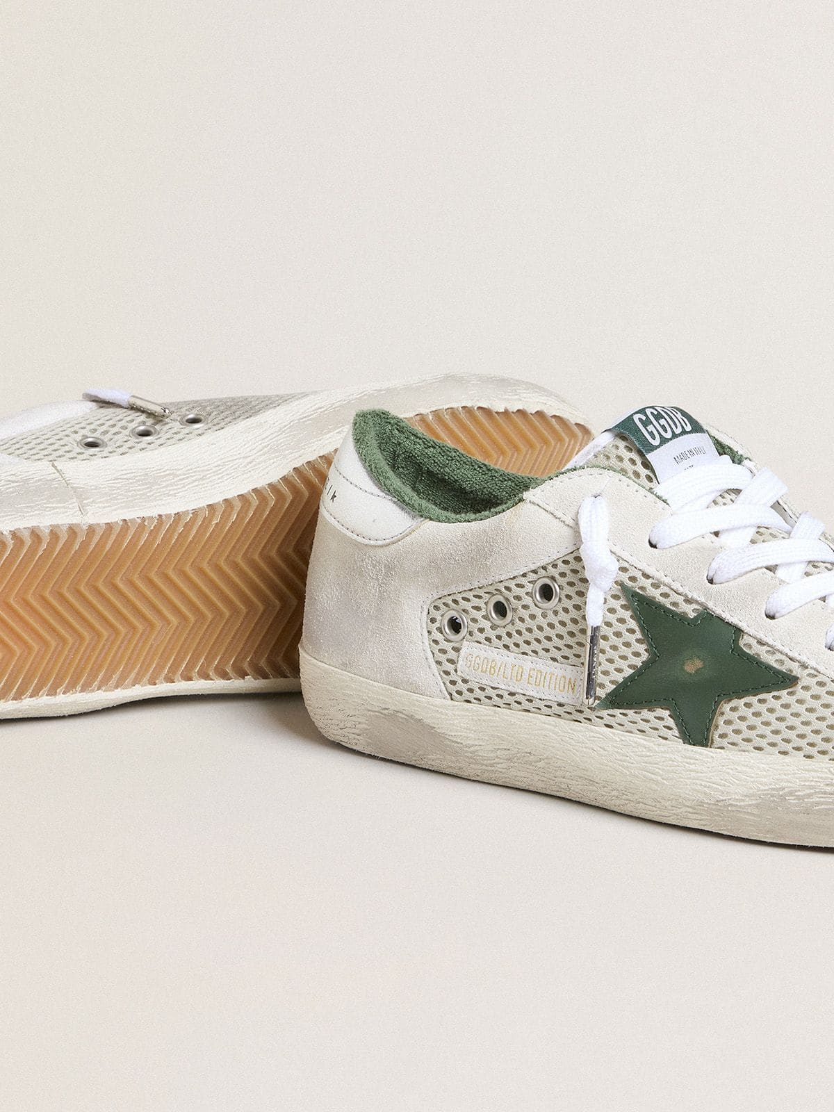 Women’s Super-Star LTD in white suede and mesh with green leather star and silver foiled leather heel tab - Golden Goose Women