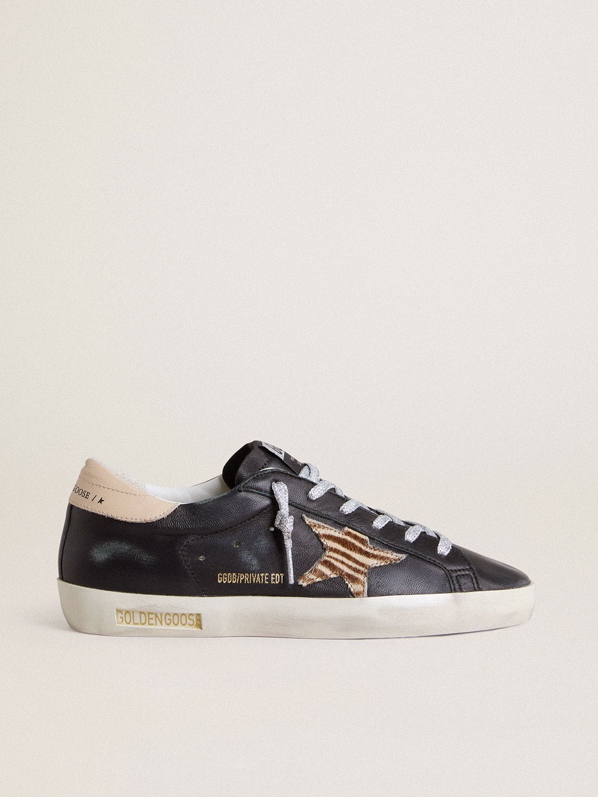 Women’s Super-Star in black nappa leather with zebra-print pony skin star and beige leather heel tab - Golden Goose Women
