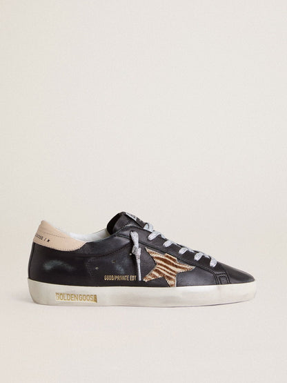 Women’s Super-Star in black nappa leather with zebra-print pony skin star and beige leather heel tab - Golden Goose Women