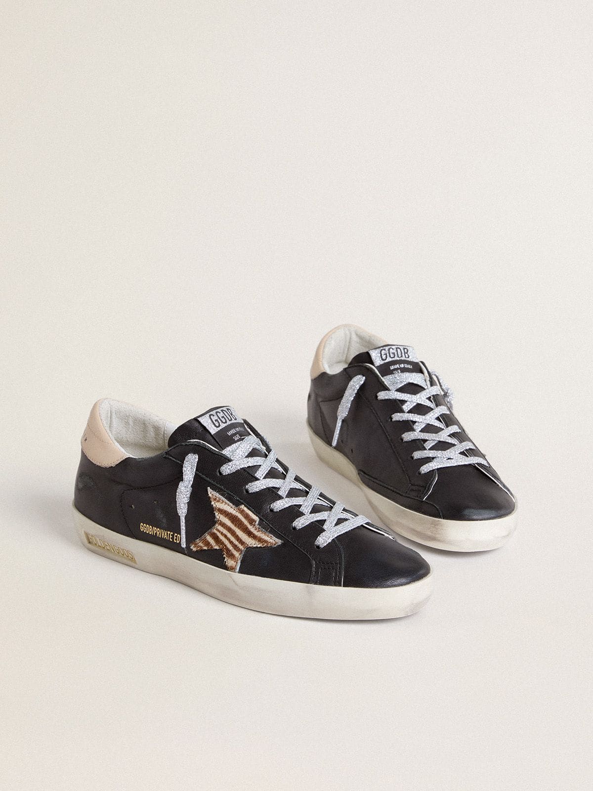 Women’s Super-Star in black nappa leather with zebra-print pony skin star and beige leather heel tab - Golden Goose Women