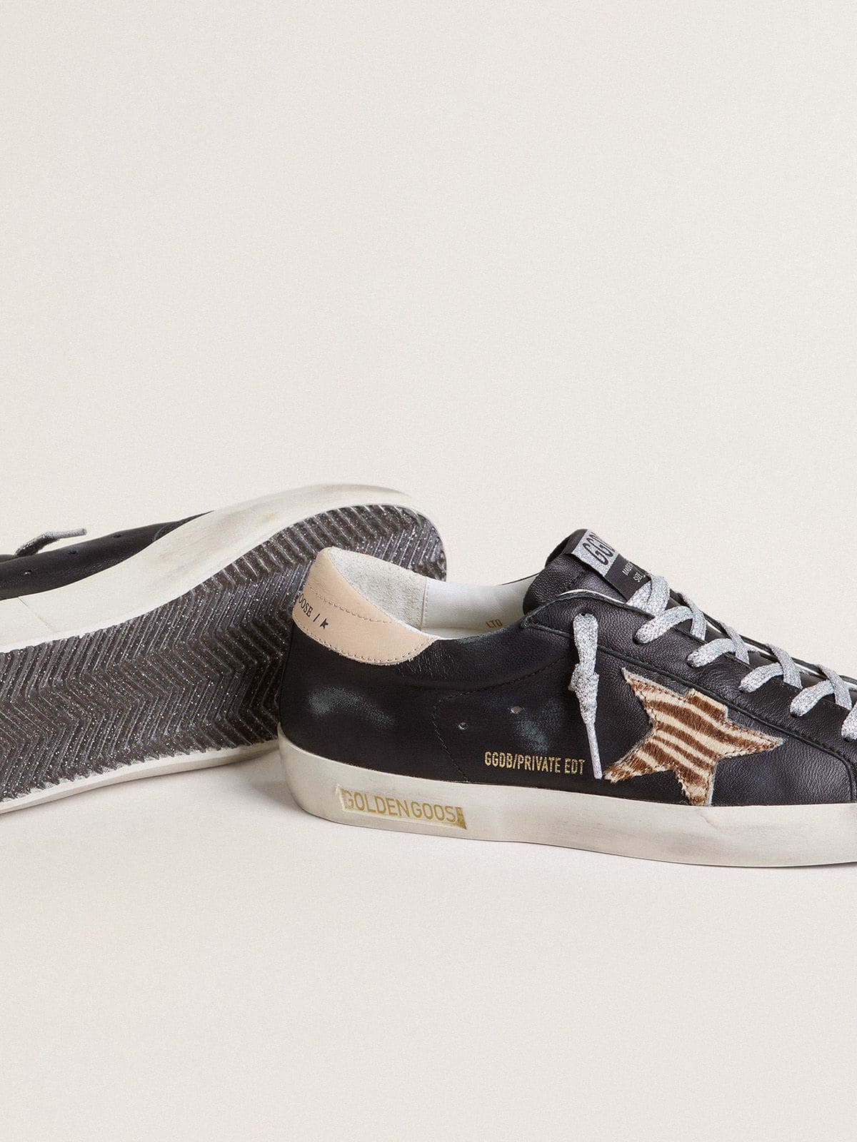 Women’s Super-Star in black nappa leather with zebra-print pony skin star and beige leather heel tab - Golden Goose Women