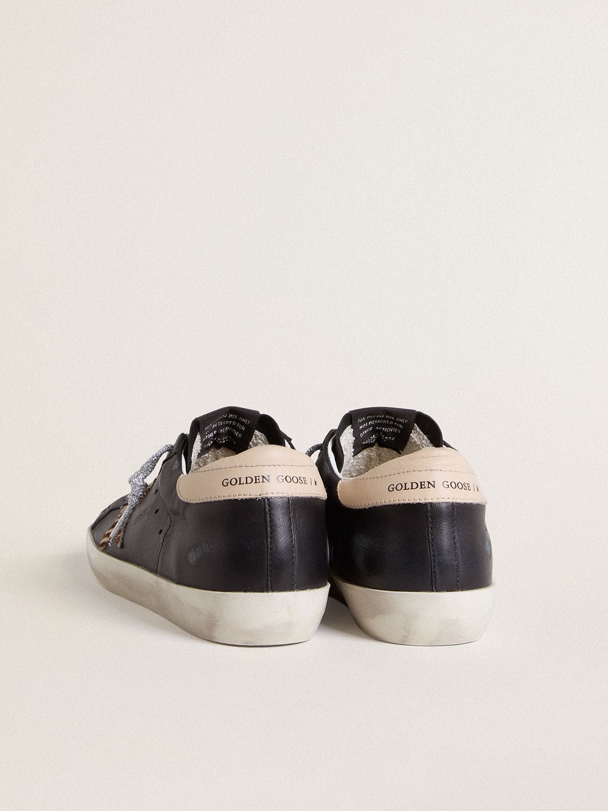 Women’s Super-Star in black nappa leather with zebra-print pony skin star and beige leather heel tab - Golden Goose Women