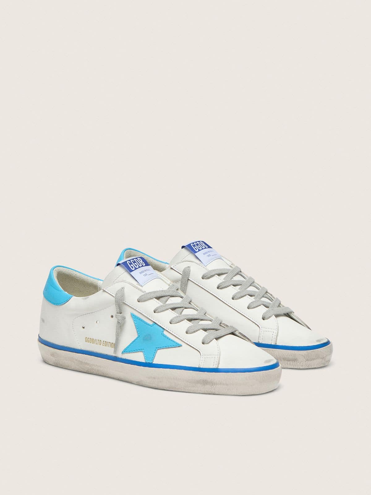 Women's Super-Star LTD in white leather with light blue leather star and heel tab - Golden Goose Women