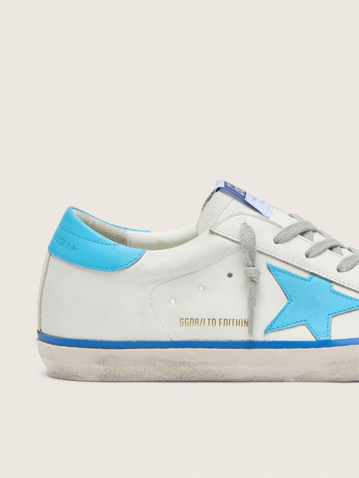 Women's Super-Star LTD in white leather with light blue leather star and heel tab - Golden Goose Women