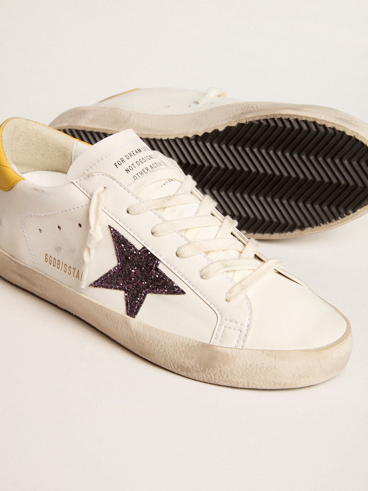 Women’s Bio-based Super-Star with red glitter star and leather heel tab - Golden Goose Women