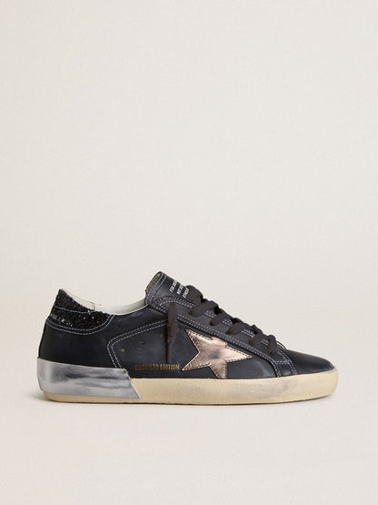 Women's Super-Star LTD in black leather with gold leather star and black glitter heel tab - Golden Goose Women
