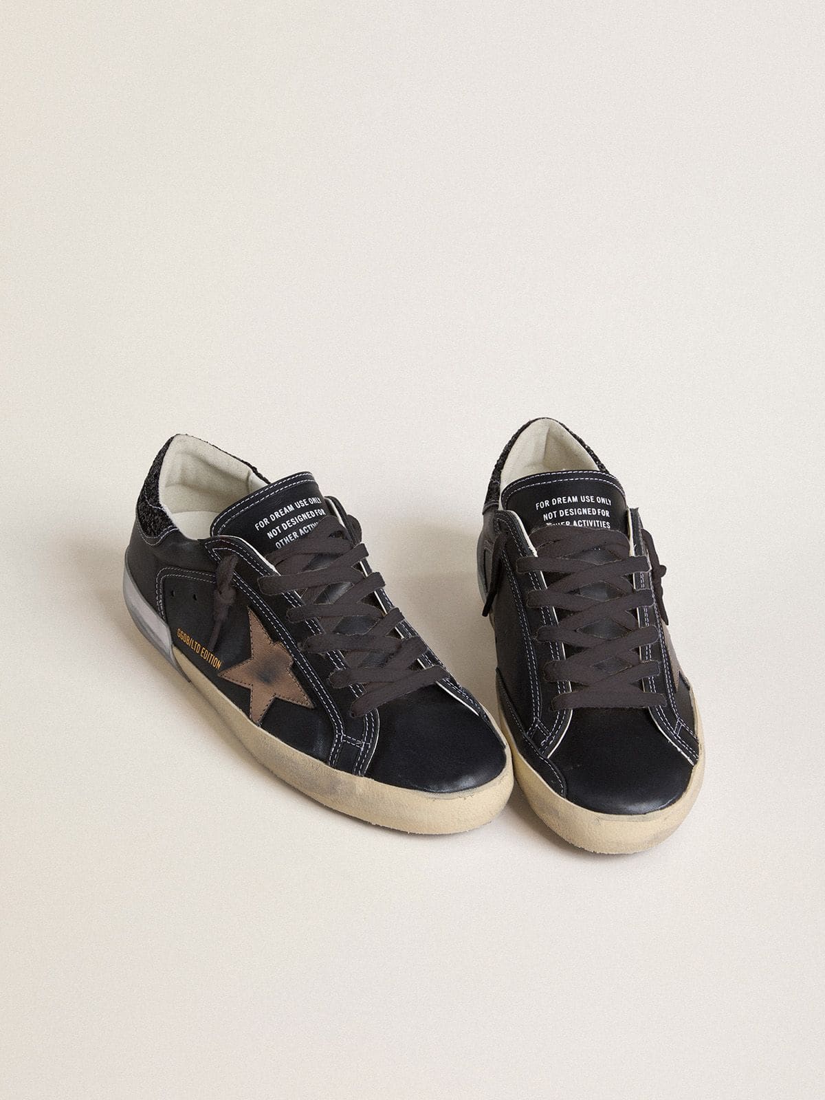 Women's Super-Star LTD in black leather with gold leather star and black glitter heel tab - Golden Goose Women