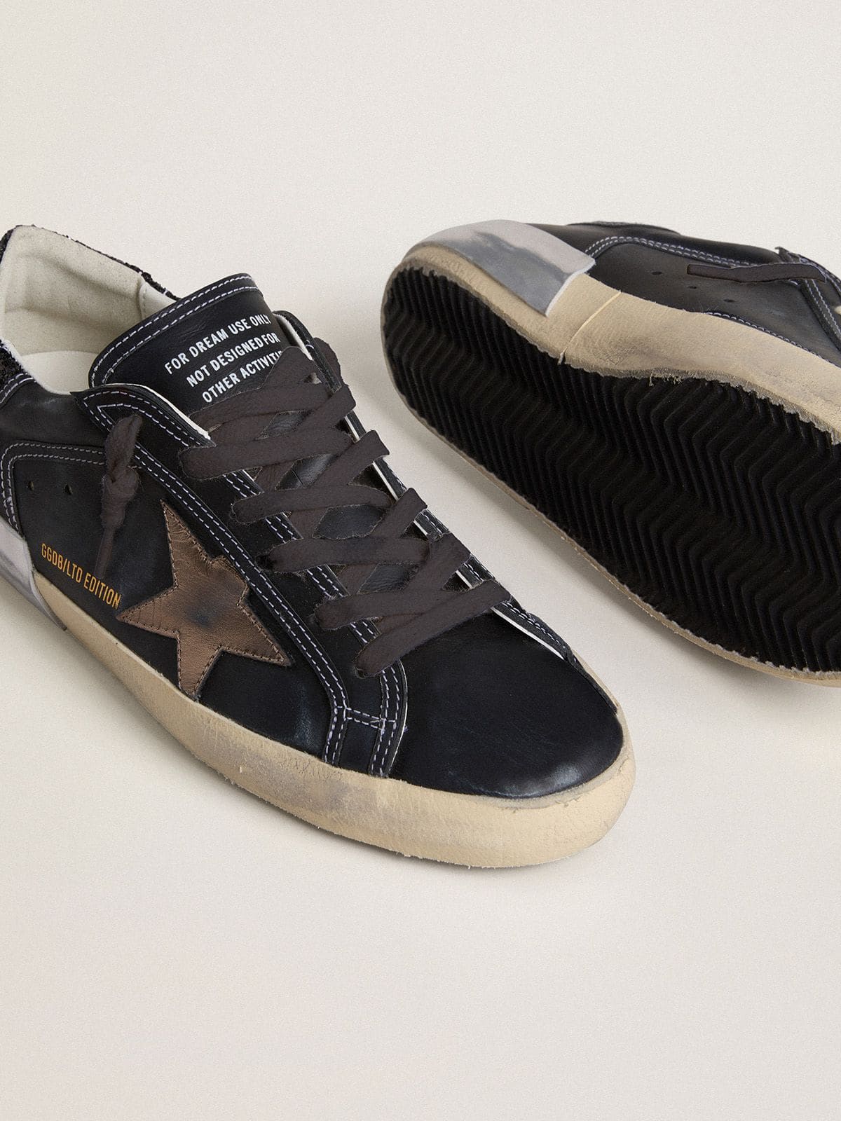 Women's Super-Star LTD in black leather with gold leather star and black glitter heel tab - Golden Goose Women