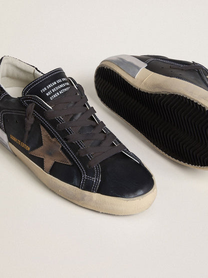 Women's Super-Star LTD in black leather with gold leather star and black glitter heel tab - Golden Goose Women