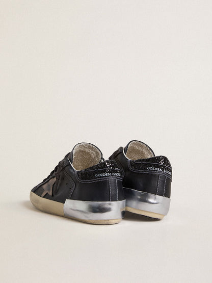 Women's Super-Star LTD in black leather with gold leather star and black glitter heel tab - Golden Goose Women