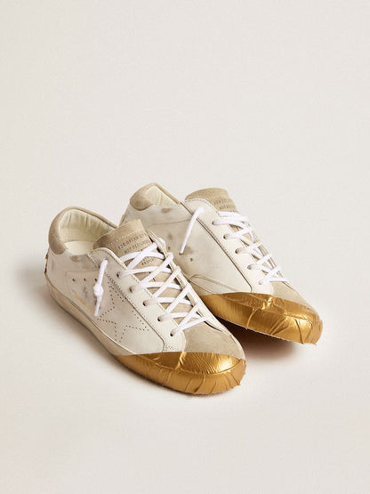 Women's Super-Star LTD in white leather with ice-gray suede inserts and gold-colored tape - Golden Goose Women