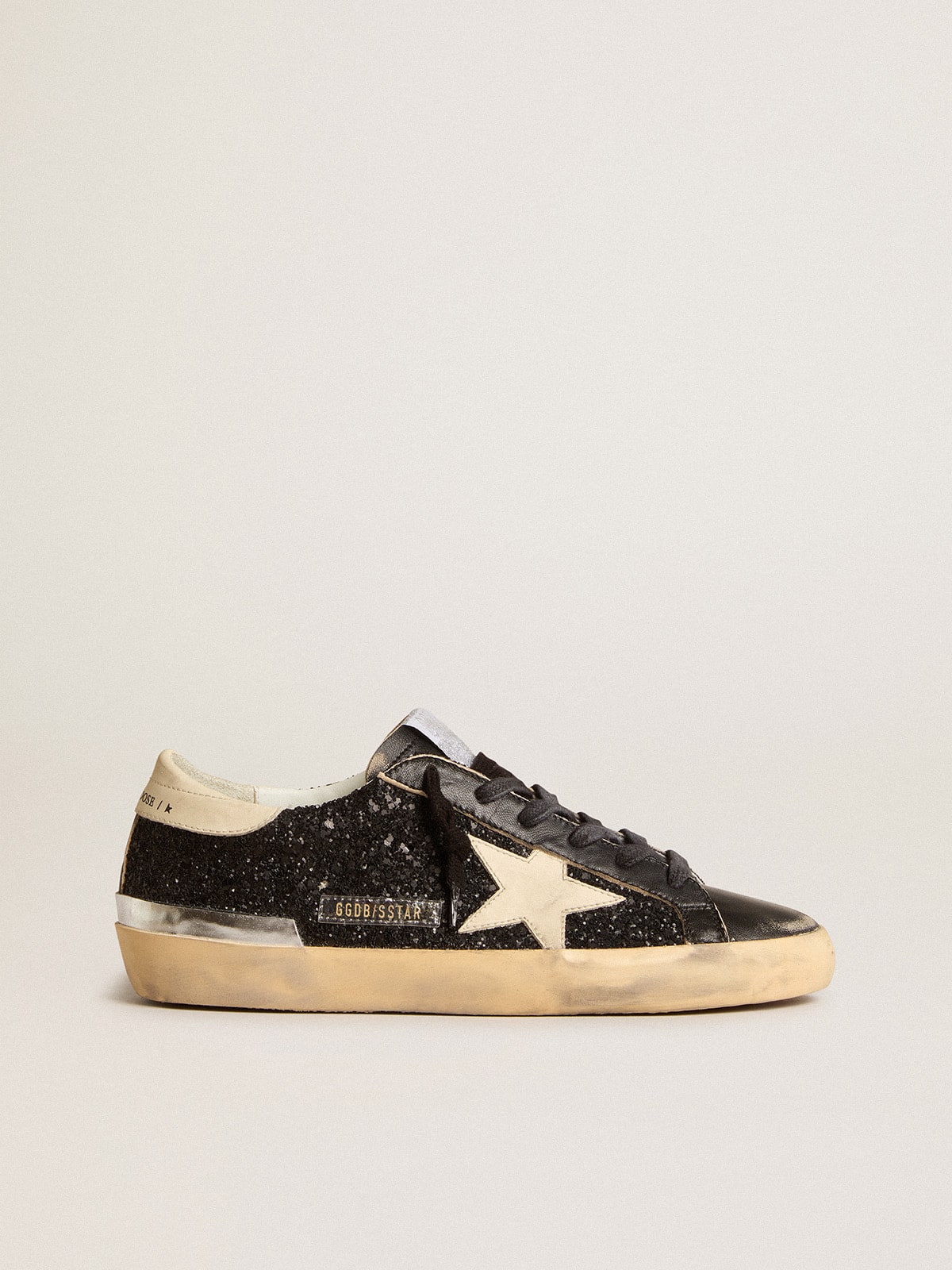 Women's Super-Star in black glitter and nappa with cream leather star and heel tab - Golden Goose Women