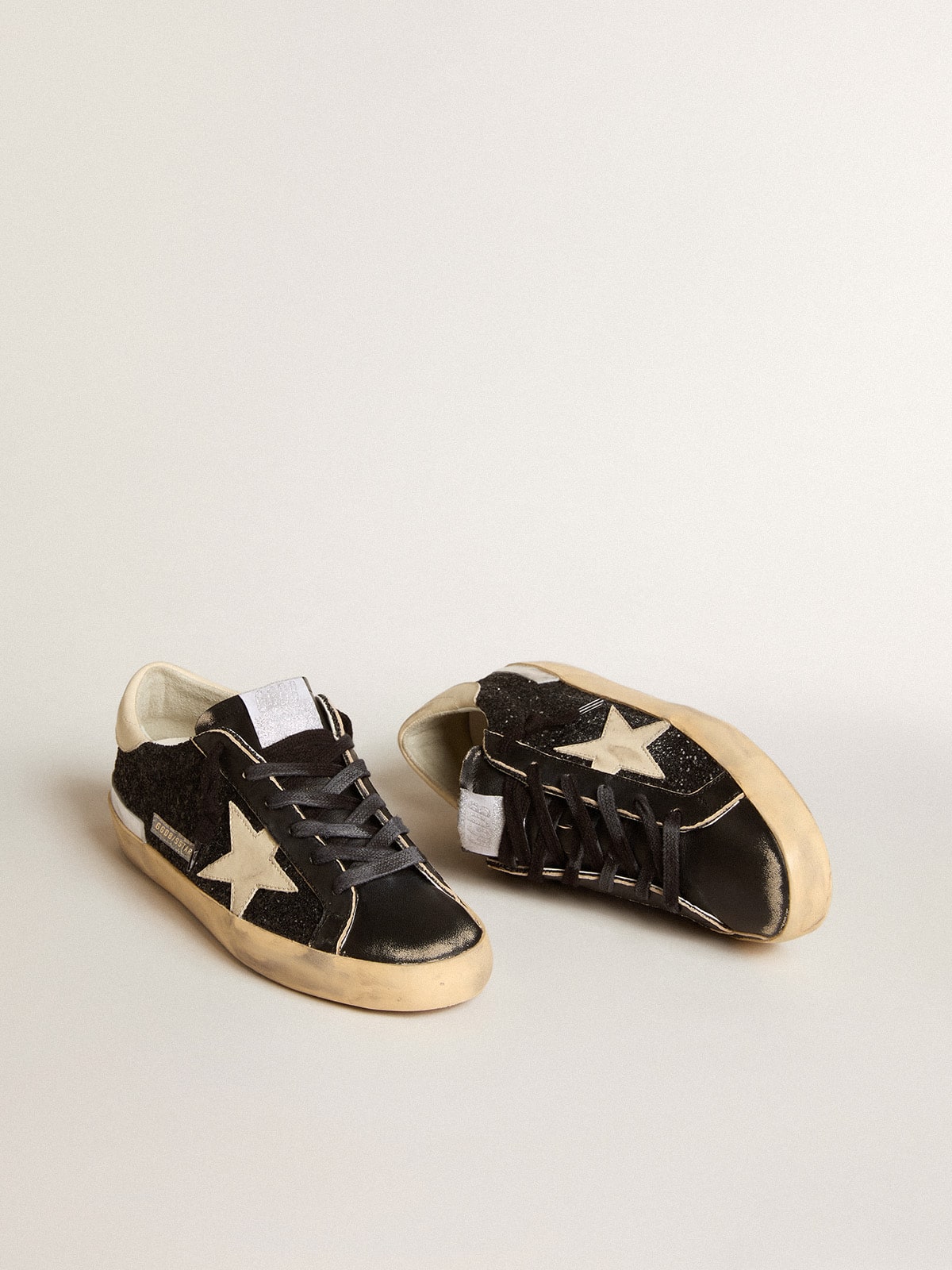 Women's Super-Star in black glitter and nappa with cream leather star and heel tab - Golden Goose Women