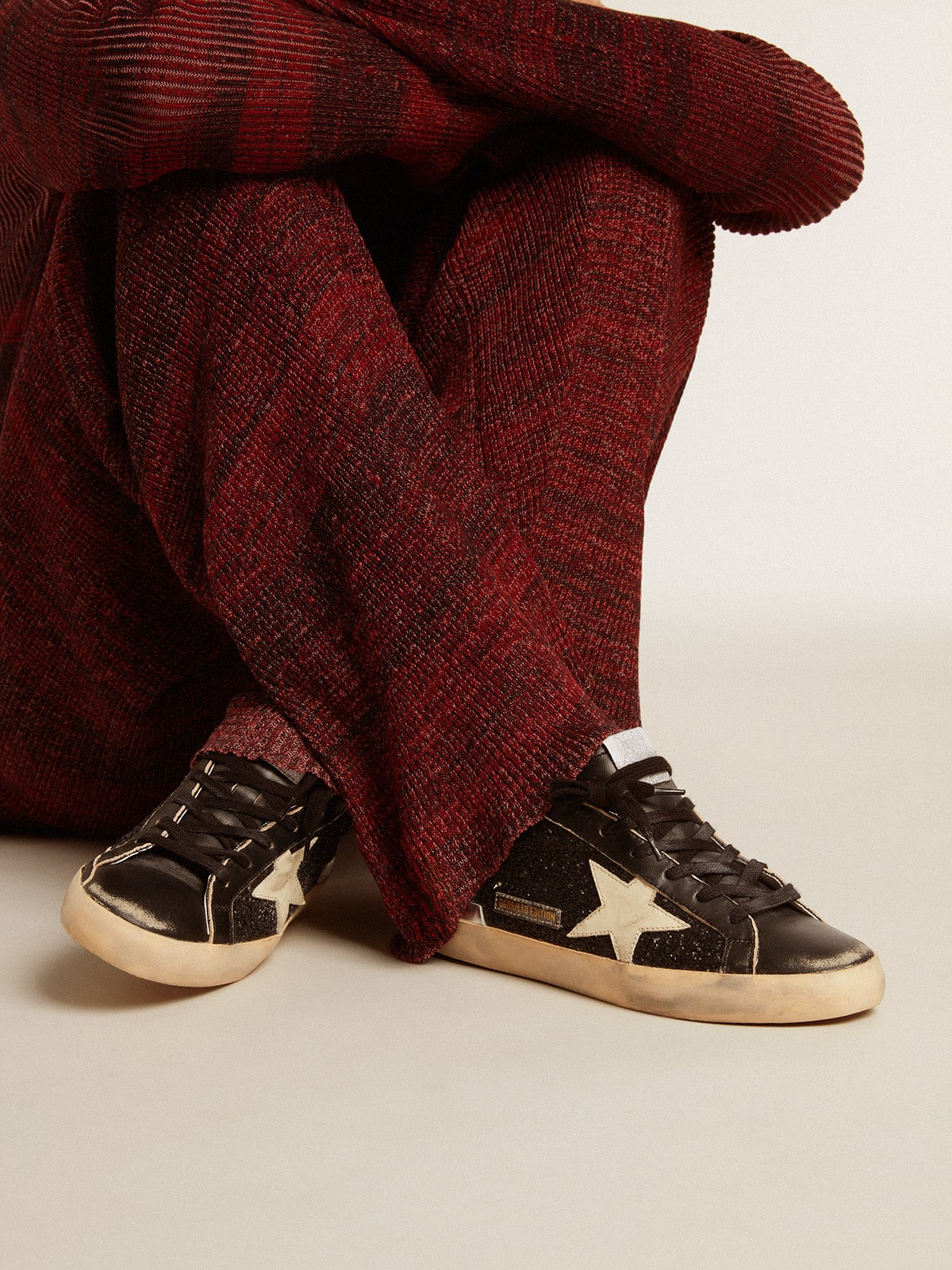 Women's Super-Star in black glitter and nappa with cream leather star and heel tab - Golden Goose Women