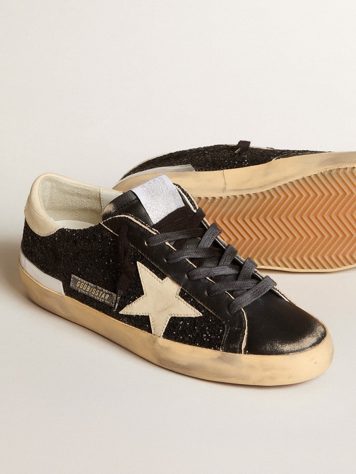 Women's Super-Star in black glitter and nappa with cream leather star and heel tab - Golden Goose Women