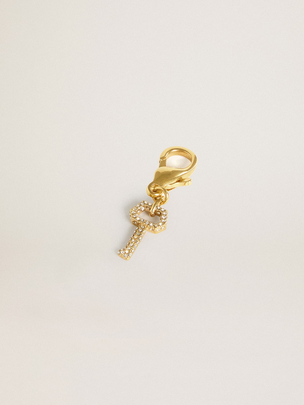 Key-shaped charm in gold-colored brass with crystals - Golden Goose Women