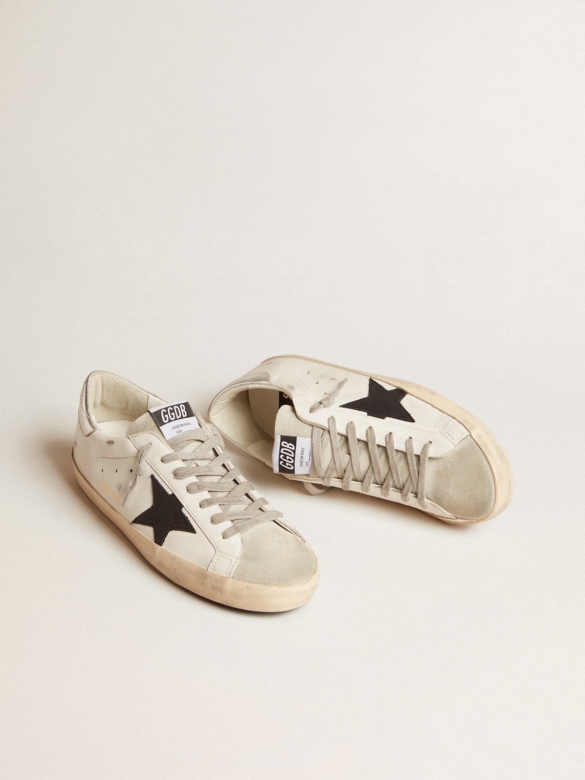 Men's Super-Star in white leather with black nubuck star and silver metallic leather heel tab - Golden Goose Men
