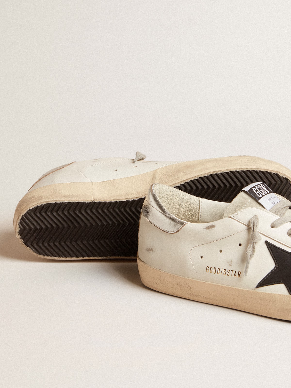 Men's Super-Star in white leather with black nubuck star and silver metallic leather heel tab - Golden Goose Men
