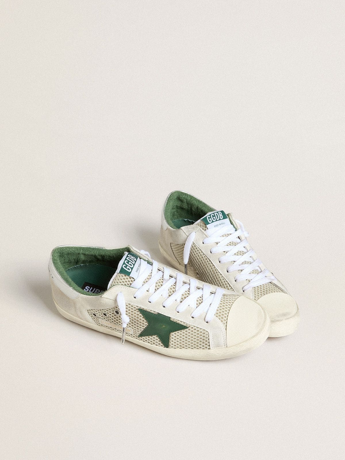 Men’s Super-Star LTD in white suede and mesh with green leather star and silver heel tab - Golden Goose Men