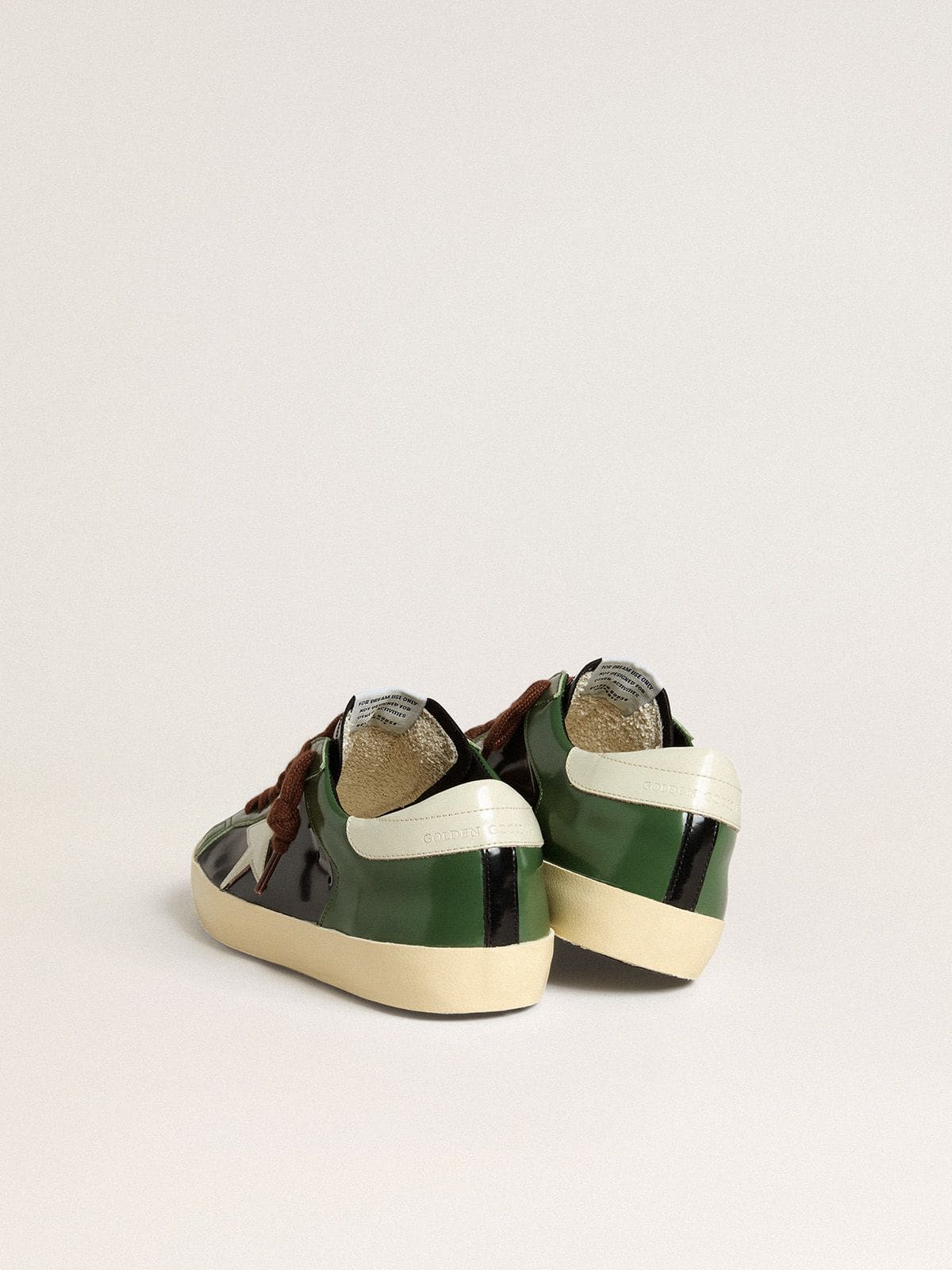 Men’s Super-Star LTD in black laminated leather with white leather star and heel tab - Golden Goose Men