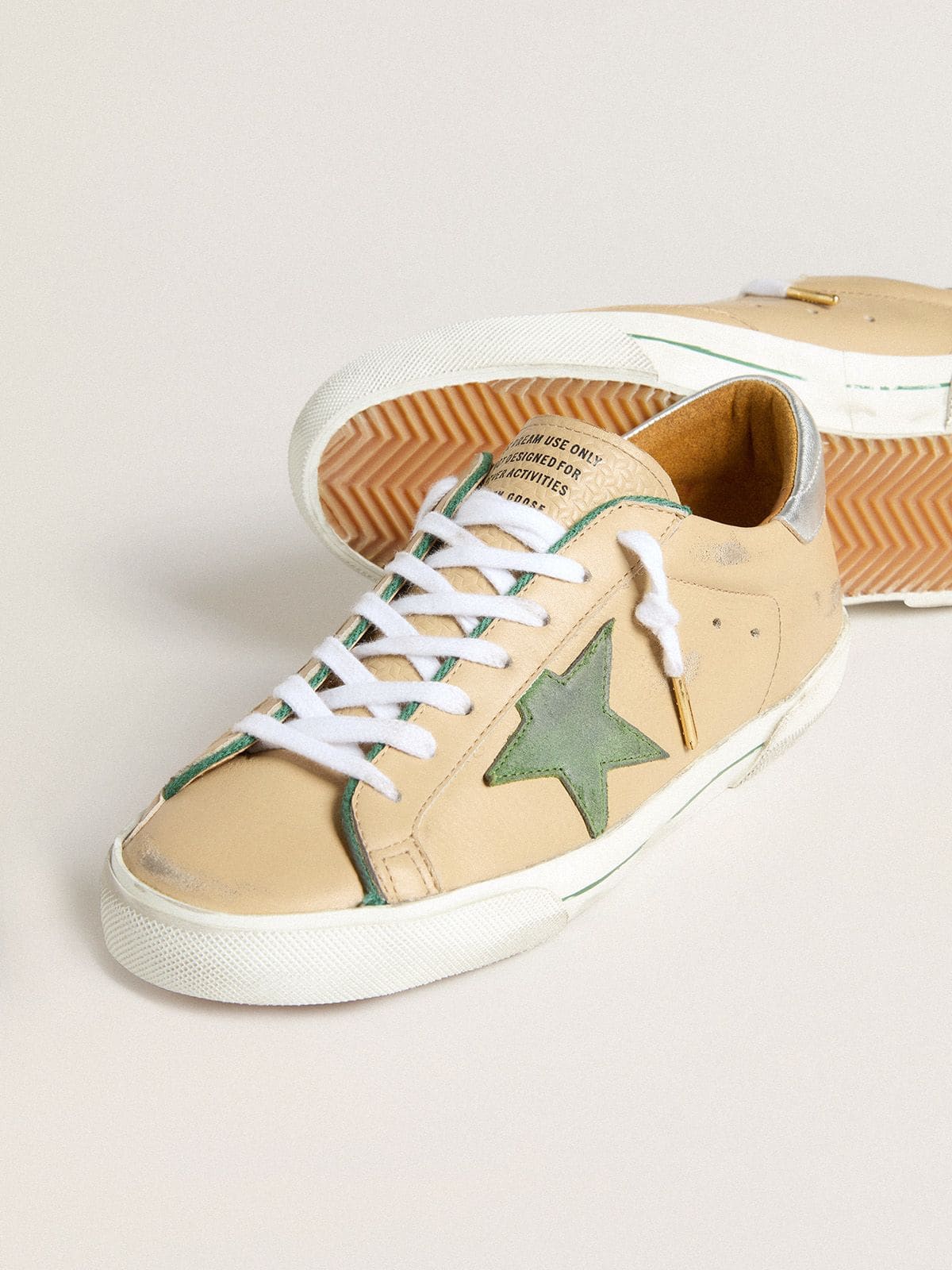 Super-Star LTD in beige leather with green suede star and silver foiled leather heel tab - Golden Goose Men