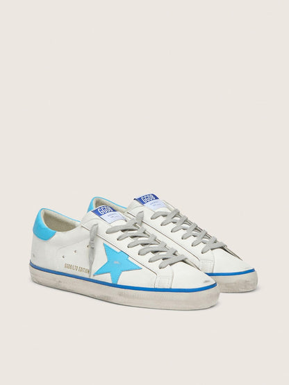 Men's Super-Star LTD in white leather with light blue leather star and heel tab - Golden Goose Men