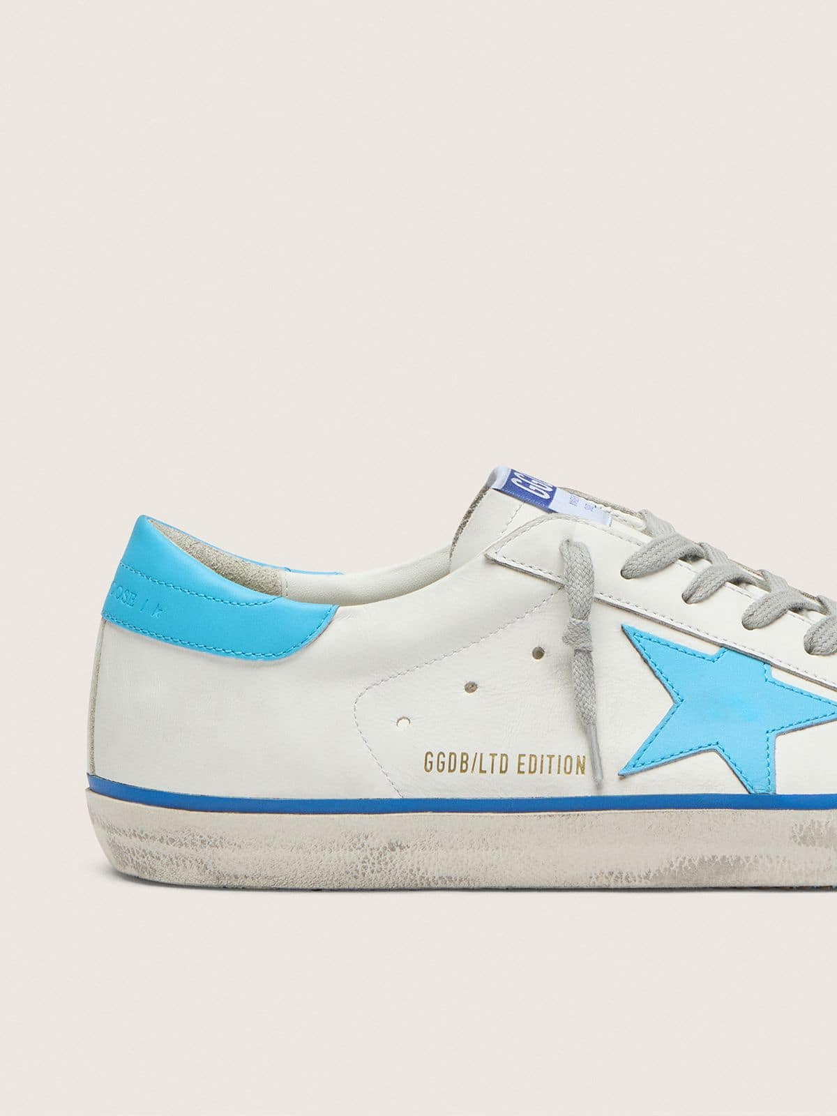 Men's Super-Star LTD in white leather with light blue leather star and heel tab - Golden Goose Men