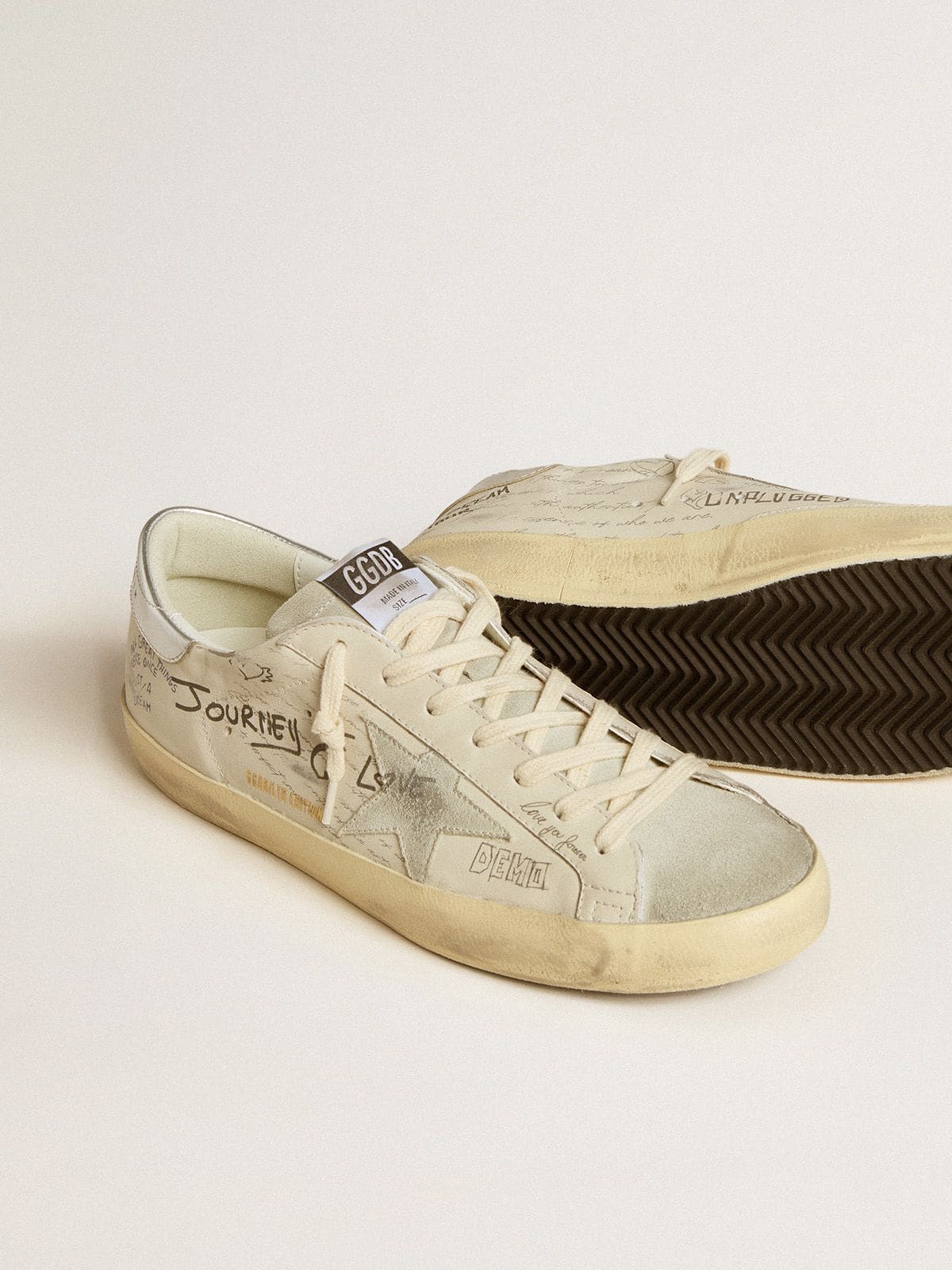 Men's Super-Star  in white leather with all-over lettering and ice-gray suede star - Golden Goose Men