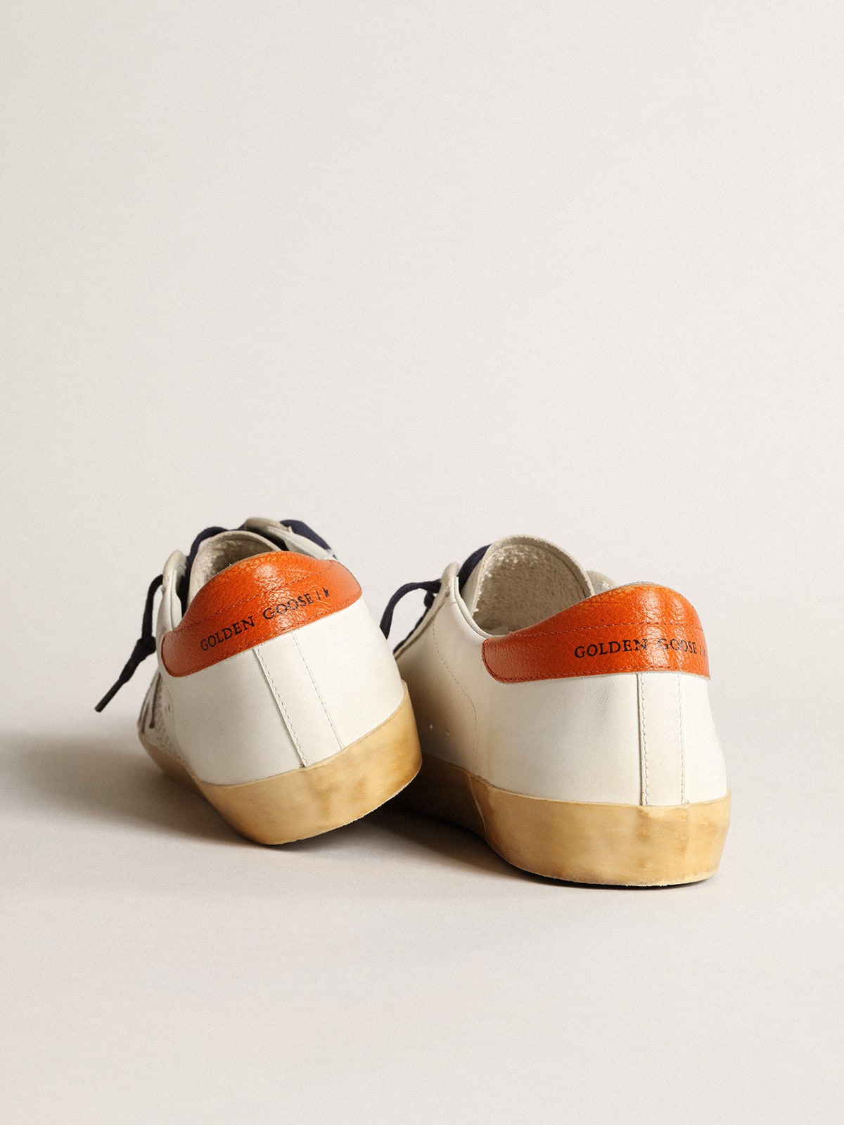 Super-Star Penstar with silver star and orange heel tab - Golden Goose Men
